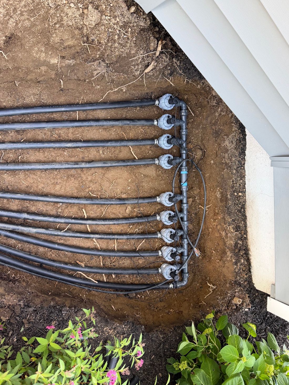 Nine-zone irrigation valve manifold installed for a new lawn sprinkler system in New Rochelle, NY