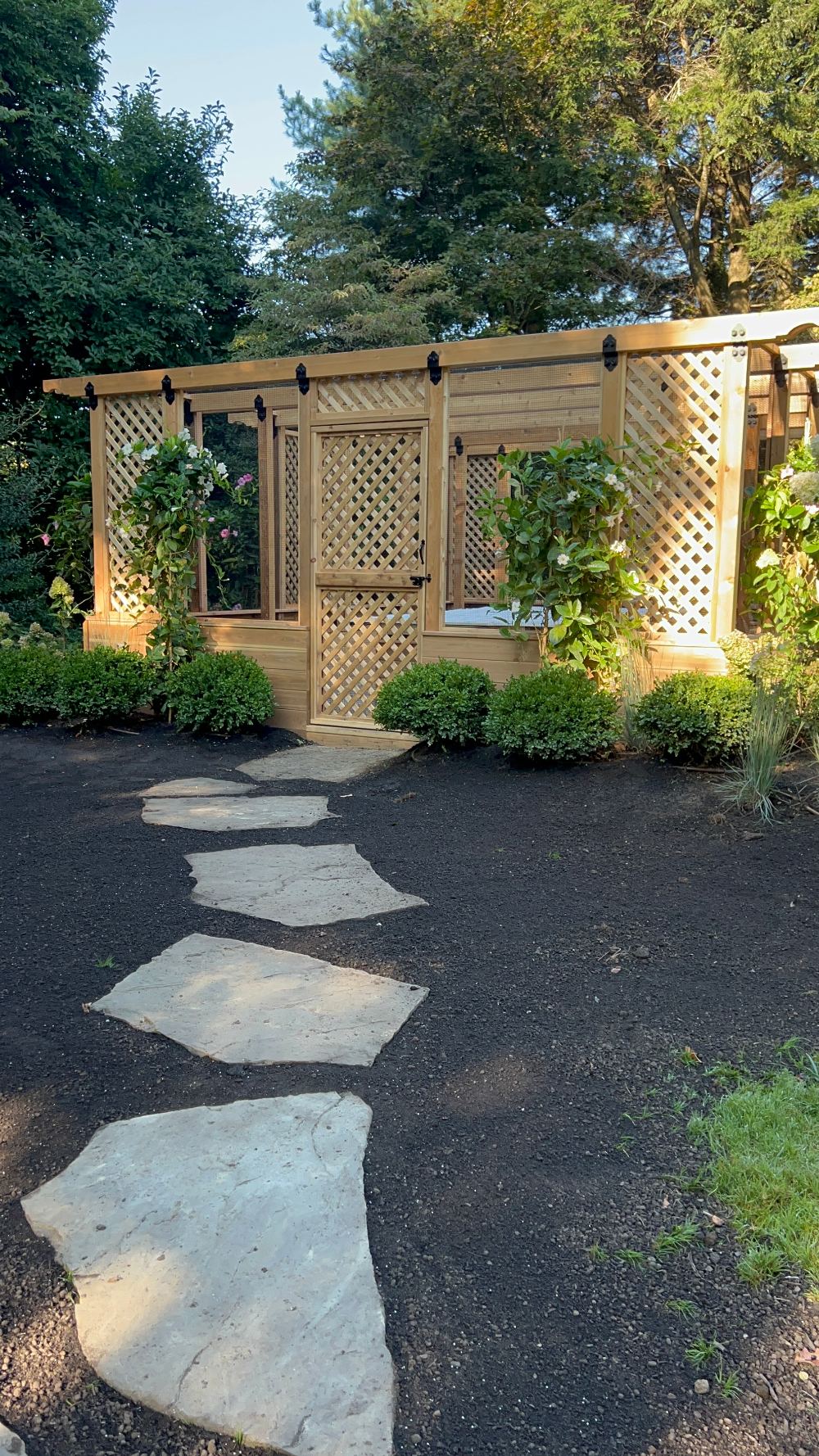 Custom enclosed cedar raised vegetable garden with lattice walls built in Scarsdale, NY