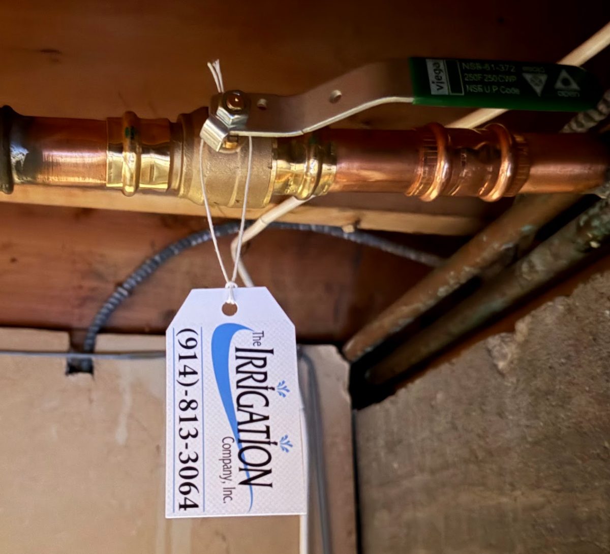Main irrigation isolation ball valve tagged by The Irrigation Company, Inc. for spring start-up and winterization in Westchester County, NY